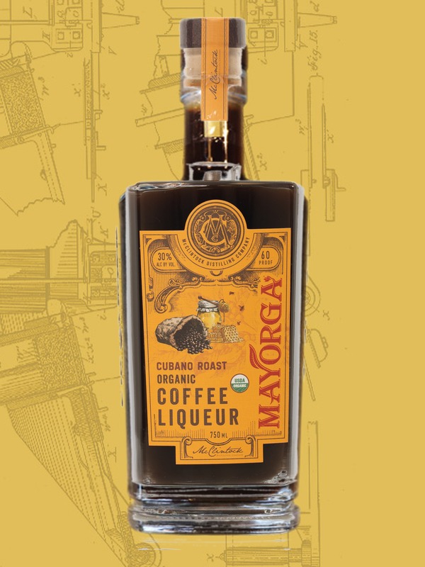 McClintock's Coffee Liqueur bottle (dark brown liquid) on mustard yellow background with McClintock Young's Brush Machine (c. 1894) drawing.